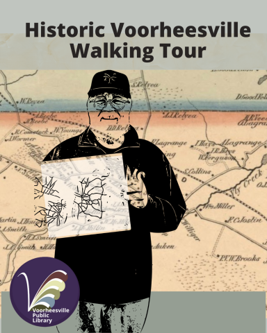 Dr. Sullivan holding up a small map with the larger map in the background